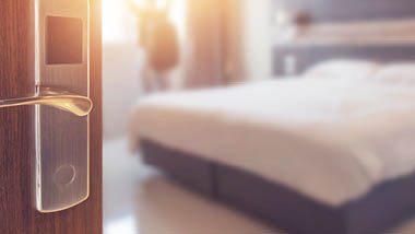 Door opening to hotel room